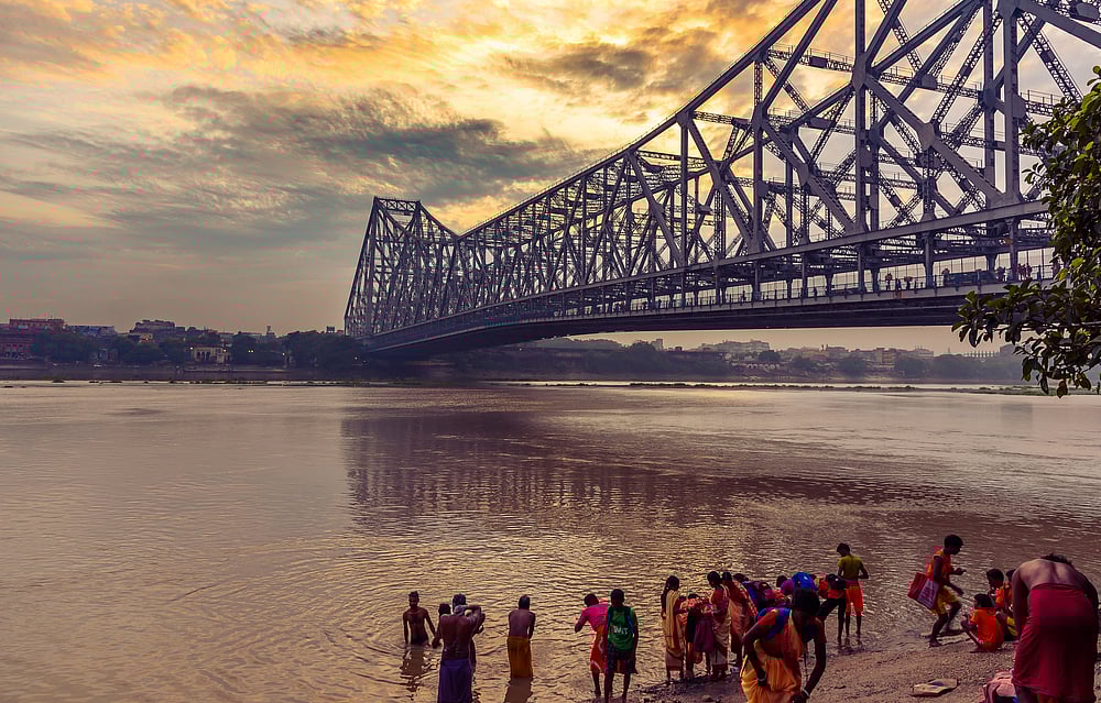 Sunset over the Hooghly with the Howrah Bridge in the foreground