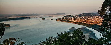The Brahmaputra River as seen from the Kamakhya Temple hilltop. On the right is Guwahati City. Credit www.shutterstock.com / Duttagupta M K