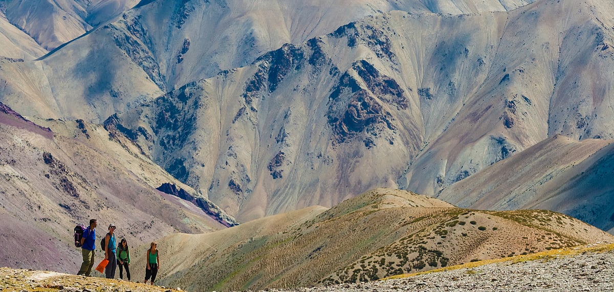 An old man leads his donkeys from Hankar to pastures above the valley