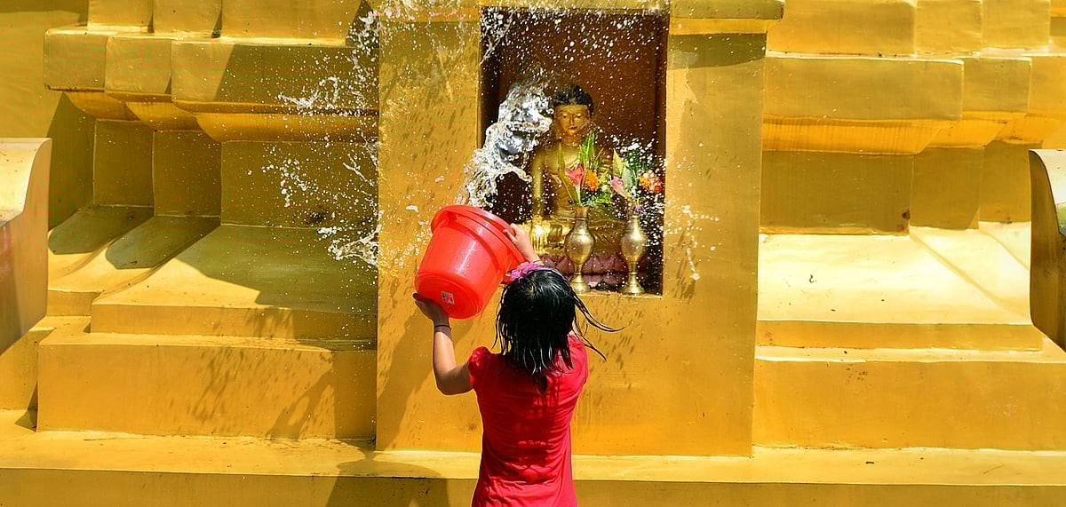 Celebratory splashing of water on Buddhas idol during Sangken Festival