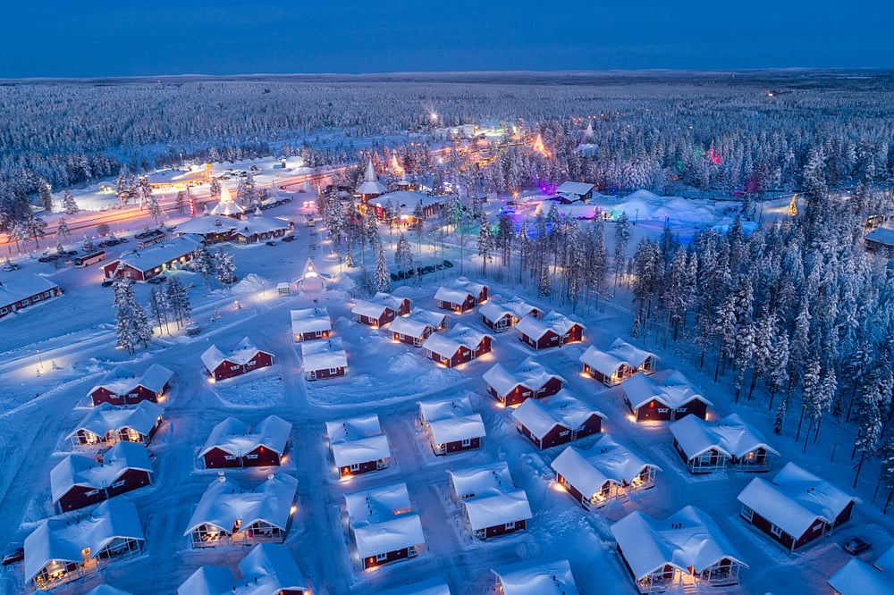 Night falls over the Santa Claus Village in Rovaniemi in Lapland in Finland            Shutterstock