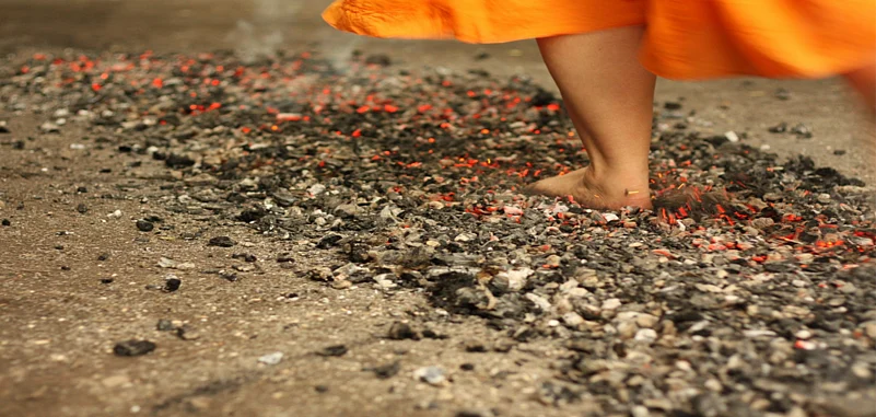 The ritual practice of walking over a coal pit