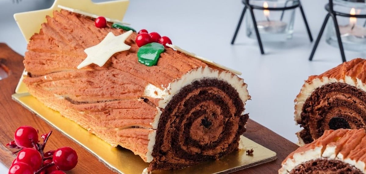 Initially, Bche de Nol (the Yule Log) was not made to be eaten and was actually an actual log of a tree. Credit LOpera