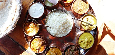 Dham food is purely vegetarian and doesnt use onions or garlic in its preparations. Credit Shutterstock