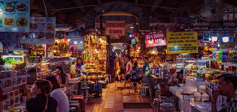 Food stalls and vendors inside Ben Thanh market - Shutterstock