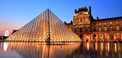 The Louvre Pyramid beckons with its contemporary allure