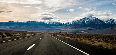 A road leading to the mountains