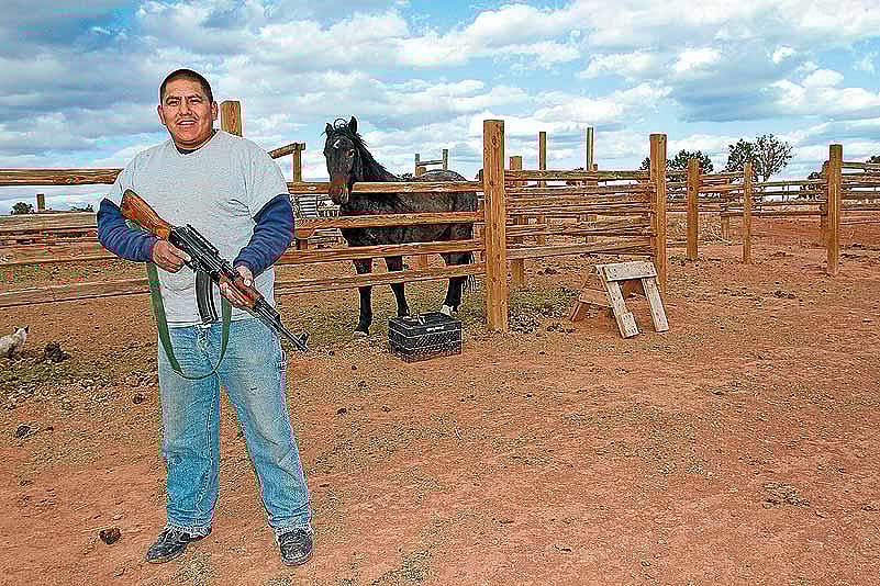 Cedric, relative of ranch owner poses with his beloved AK-47 (civil variant)