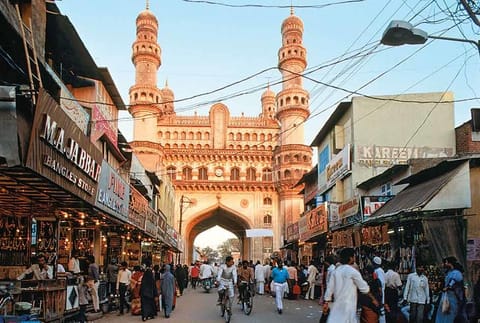 The busy street of Lad Bazaar in Hyderabad, with the Charminar in the background