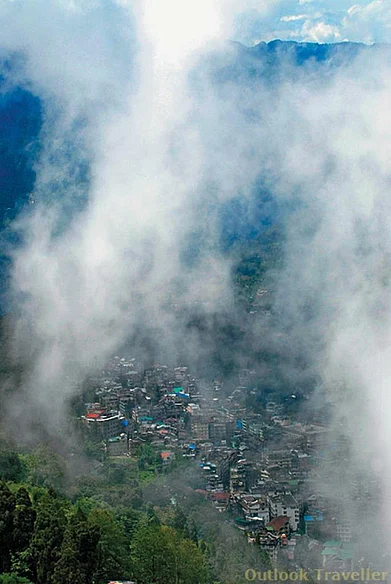 Mist descends on the bustling city of Gangtok