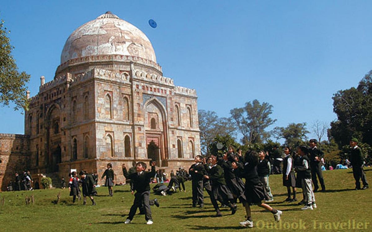 Children play outside the Bada Gumbad, at Lodi Gardens