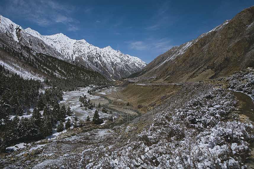 Snow covered mountains surround the Sangla valley in April