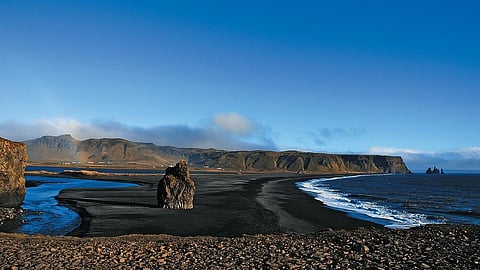 Experience walking on the black sand beaches of Iceland