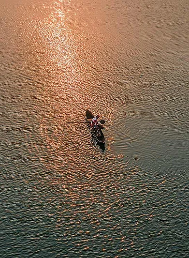 Fishing by the estuary near Siolim Bridge