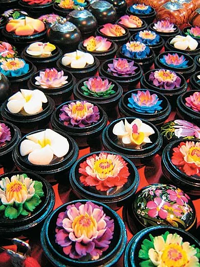 Hand-carved flower-shaped soap in lacquered boxes at the Hua Hin night market