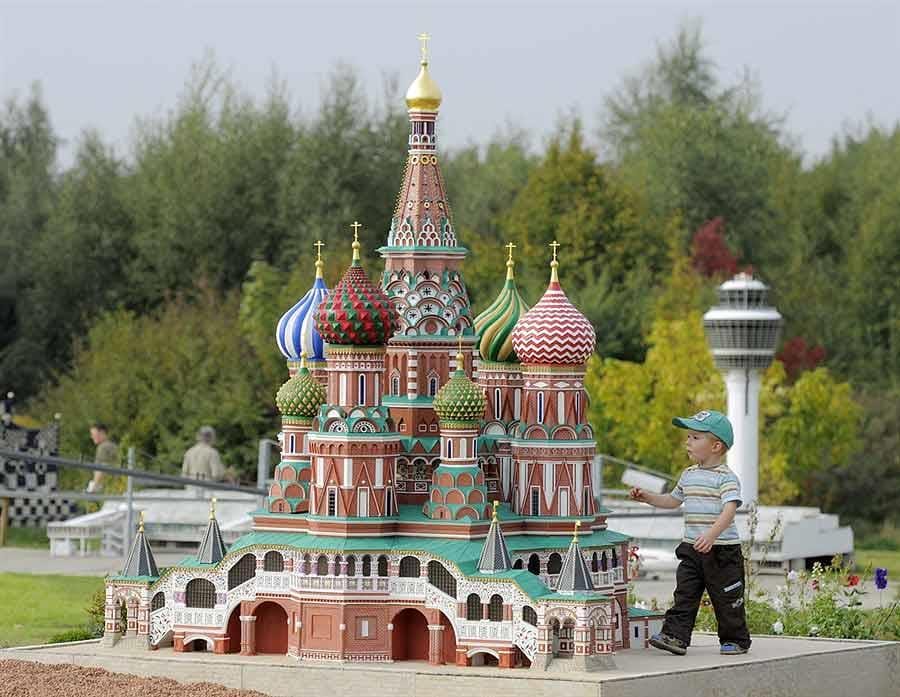 A child look at the intricate designs on the replica of the St. Basils Cathedral, Moscow Russia