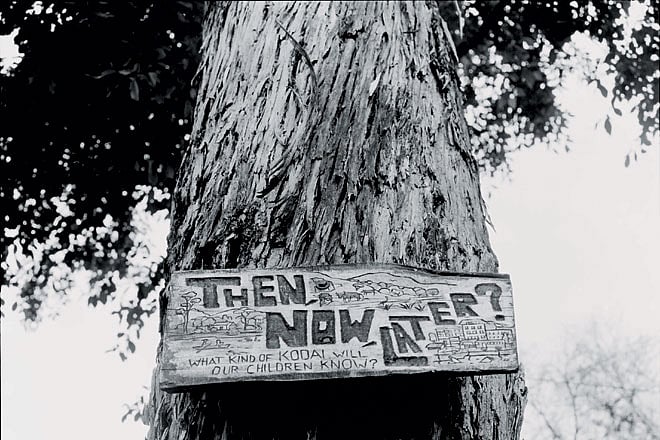 A sign posted at a school in Kodaikanal encourages visitors to think about changes in the ecology of the lake basin, and the problems caused by the growing number of tourists.