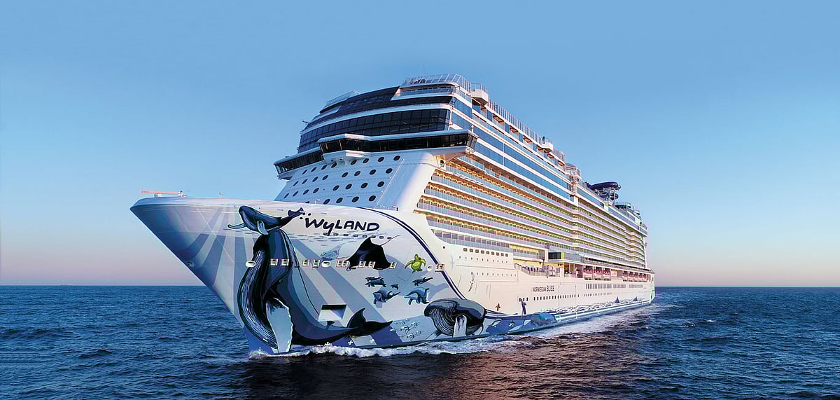 The humongous Bliss charts the waters calmly, marine artist Wylands art visible on its bow