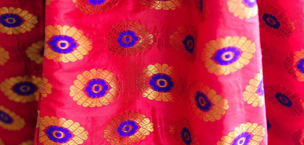 The paat silk mekhela chadars have intricate designs made out of golden silk threads or guna all over