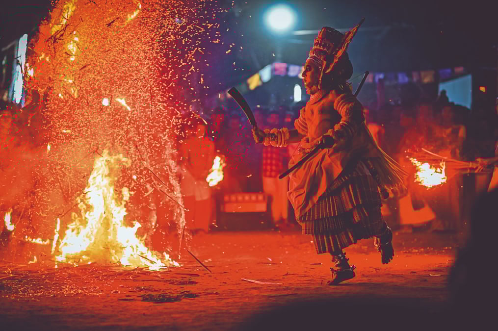 Shutterstock : Theyyam And Bhuta Kola are ritualistic art forms that narrate the legends of Lord Shiva