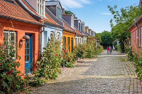 Colourful old cottages on a quiet street in Aarhus, Denmark