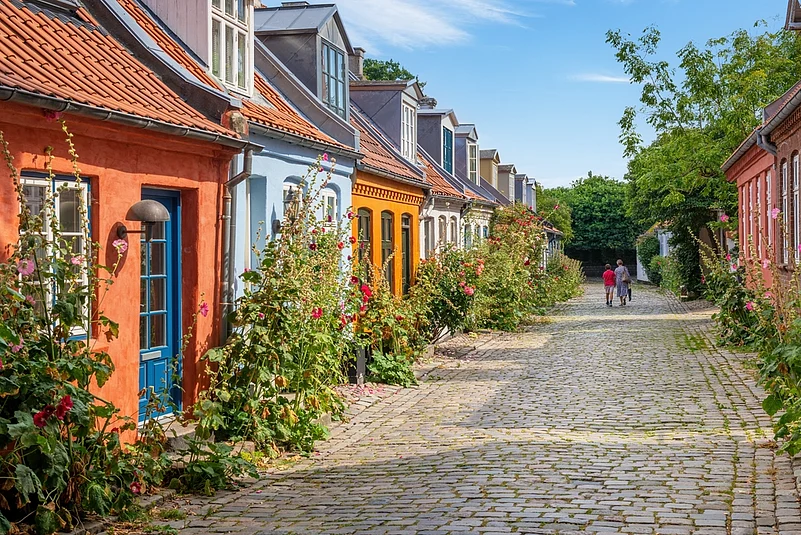 Colourful old cottages on a quiet street in Aarhus, Denmark