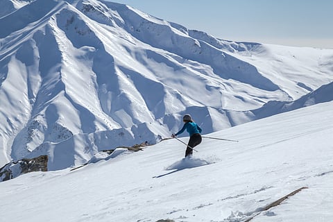 A woman skies in Gulmarg