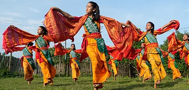 Dancers mimic butterflies while performing the Bagurumba. Photo by Surajit Sharma