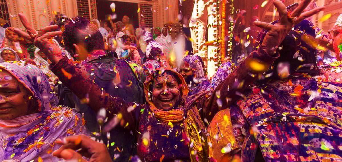 People celebrate the traditional Holi at Radharani temple. Holi is the most celebrated and colorful festival of India