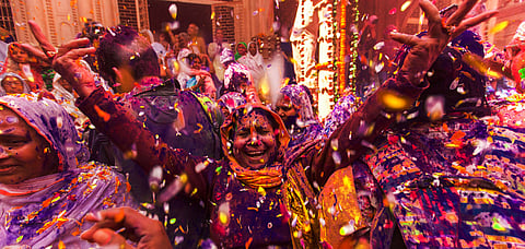 People celebrate Holi at Radharani temple, Vrindavan
