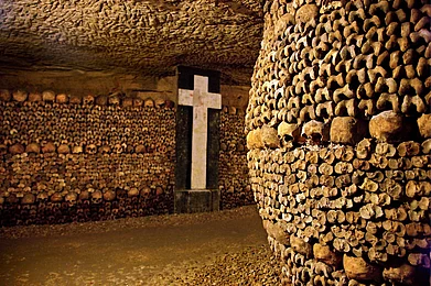 In the Catacombs of Paris, a huge ossuary in some abandoned mines in Montparnasse Photo credit Heracles Kritikos / Shutterstock