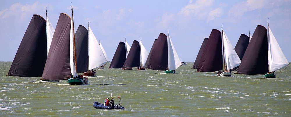 Traditional Frisian wooden sailing ships on Lake Ijsselmeer, The Netherlands