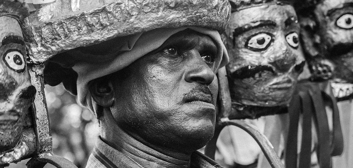 A masked performer at the Satpura Monsoon Festival