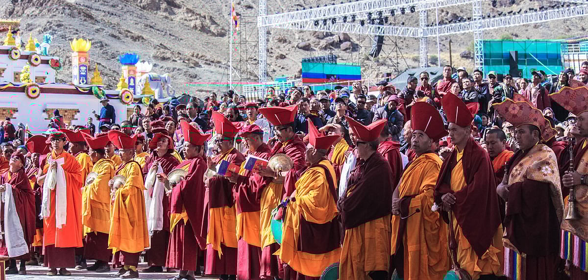 Monks gather around to pray at the Naropa Festival taking place at the Hemis Monastery