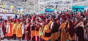Monks gather around to pray at the Naropa Festival taking place at the Hemis Monastery
