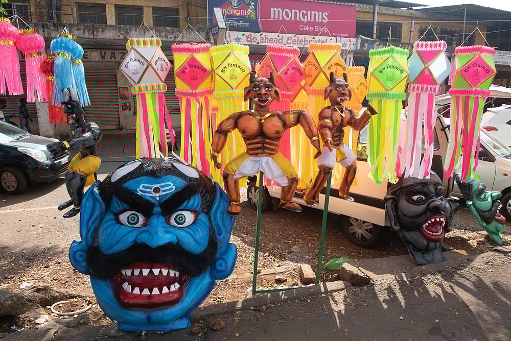 Narakasura masks being sold at Mapusa market in Goa