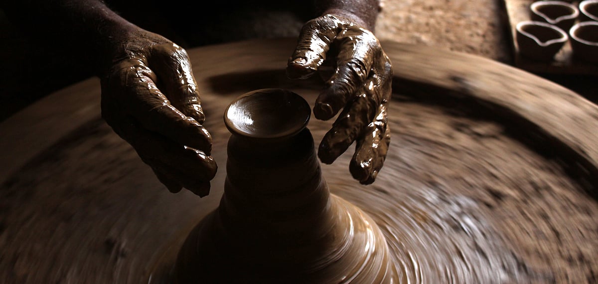 A potter in Kumhaargram, Uttam Nagar, Delhi