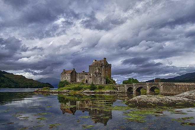 Eilean Donan castle - The castle sits on top of a small tidal island right where three lochs meet, in the western highlands