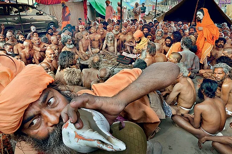 Naga sadhus of Juna Akhara attend a ceremony at the Mahakumbh in 2013 - null