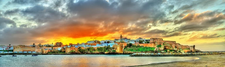 The sun sets over Rabat, capital of Morocco, and the River Bou Regreg. Credit www.shutterstock.com / Leonid Andronov - null
