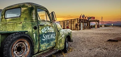 Shutterstock : A car wreck at the rebuilt Cool Springs station in Californias Mojave Desert