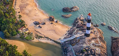 Lighthouses paint a beautiful picture atop rocky terrains and amidst lush greenery