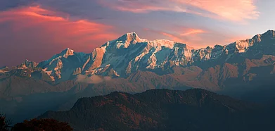Shutterstock : Cirrostratus clouds over the snow-clad Gangotri peaks, as seen from Chopta