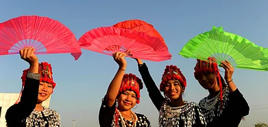 Singpho girls dressed in traditional attire for a dance performance in Namsai