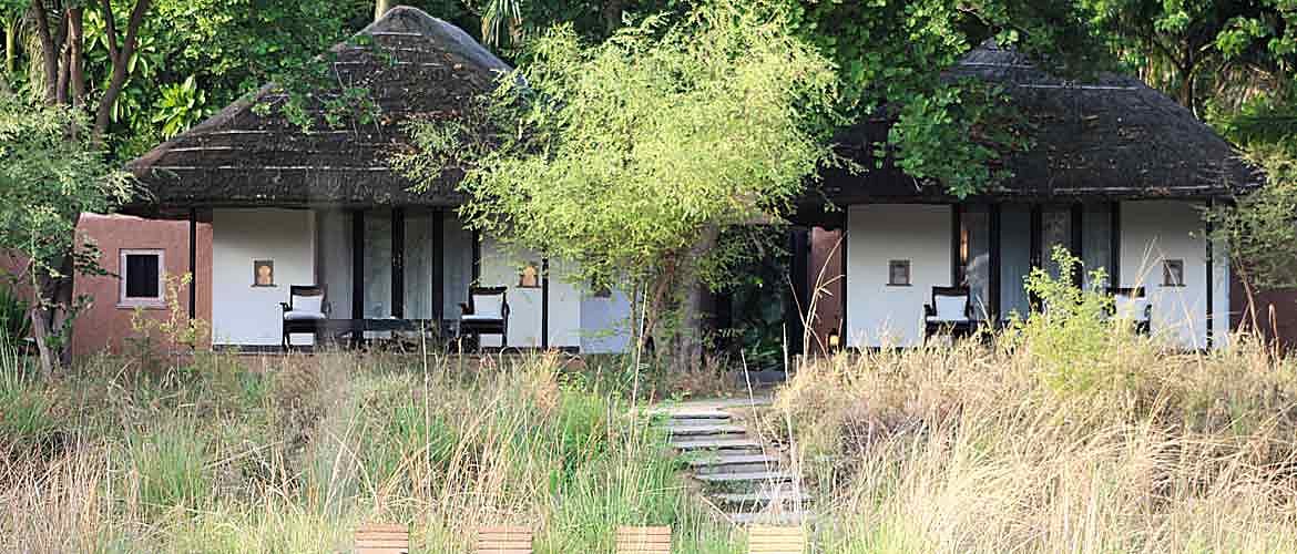 The cottages at Khem Villas stand surrounded by dense foliage
