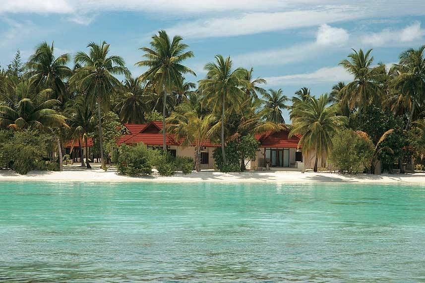 Beach-facing cottages at the Kurumba Maldives