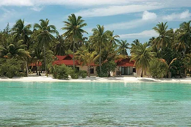 Beach-facing cottages at the Kurumba Maldives