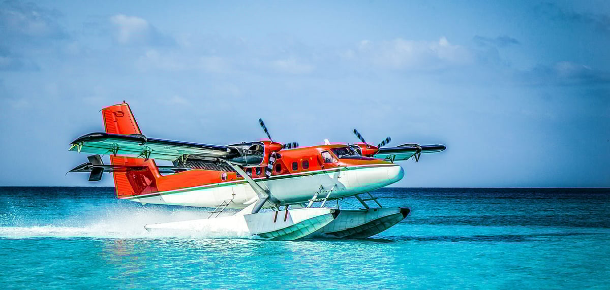 A seaplne landing in the ocean lagoon