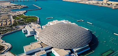The Louvre museum and Abu Dhabis aerial cityscape make for a stunning view
