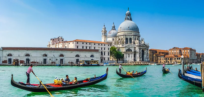 Beautiful view of the gondolas on the Canal Grande with Basilica di Santa Maria della Salute in the background